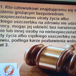 Plakat z paragrafem informujący co grozi za nieudzielenie pomocy